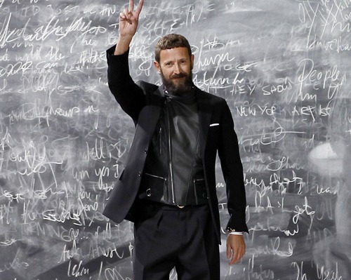 Italian designer Stefano Pilati waves at