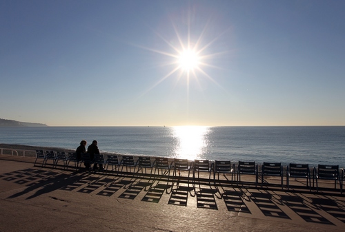 People sit in front of the Mediterranean